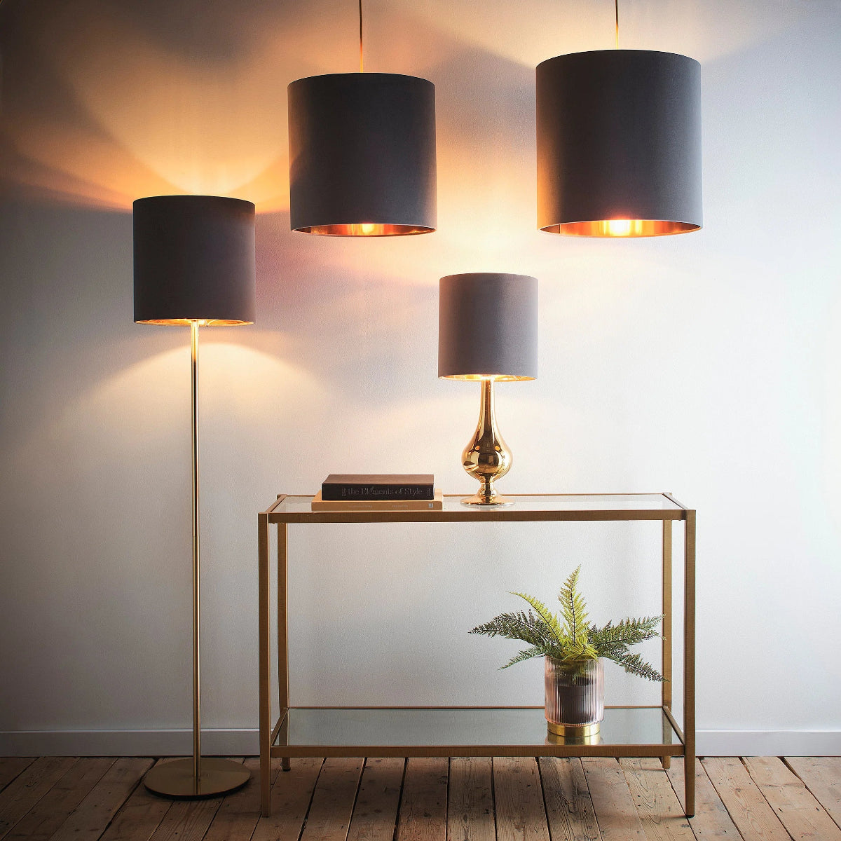Modern interior with a console table, floor lamp, and wall-mounted lamps.